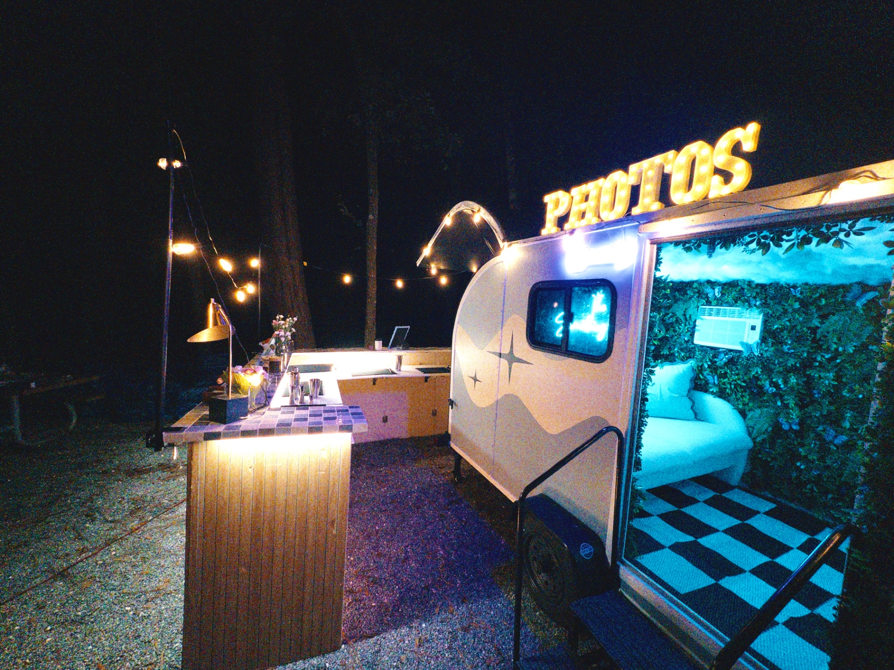 Wide night view of the bar and camper photo booth