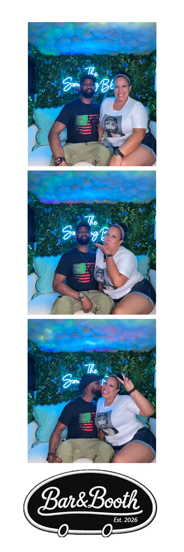 Couple posing in The Something Blue camper photo booth