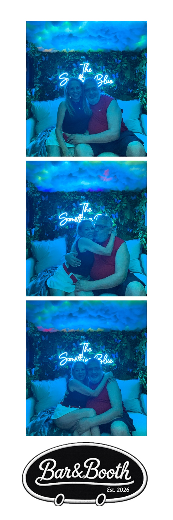 Couple photo strip in front of the butterfly grass wall